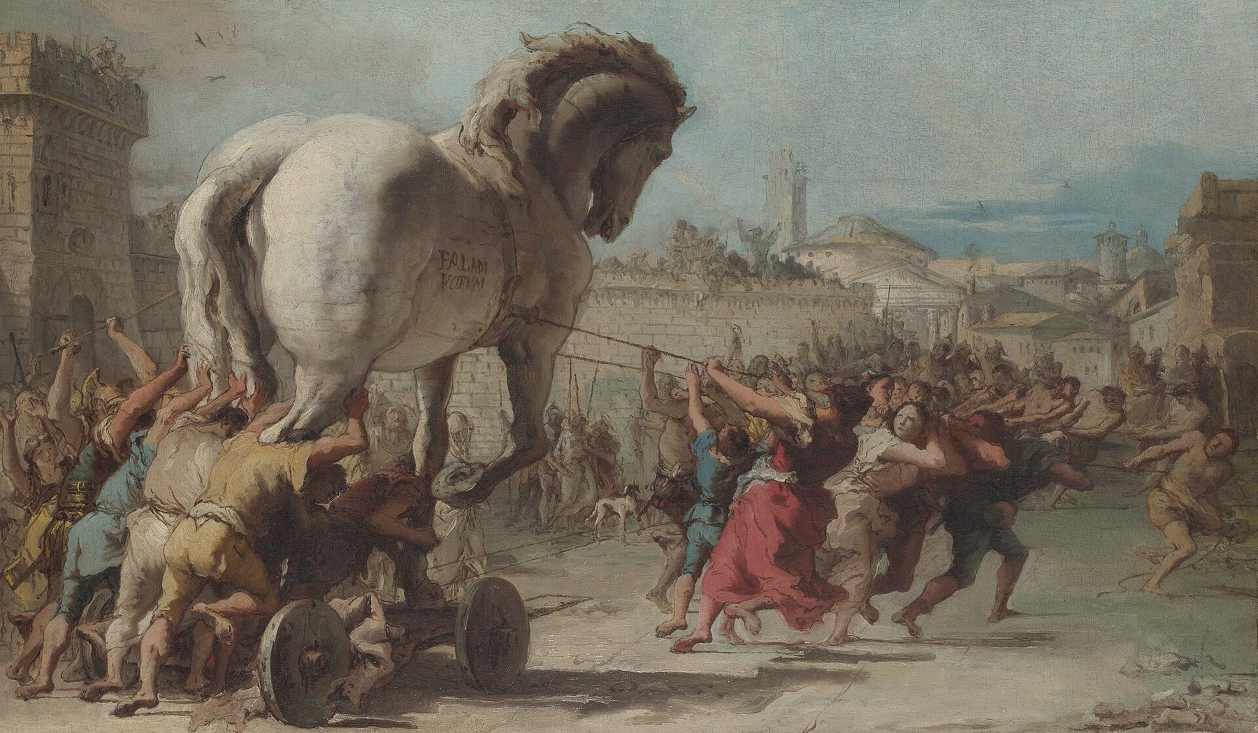 Giovanni Domenico Tiepolo’s painting of a crowd of Trojans hauling a giant white wooden horse on a wheeled platform through their city, pulling on ropes and pushing from behind.